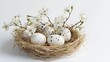 © Олег Чуприна - Straw nest with speckled eggs and delicate flowers captures the beauty of nature in springtime