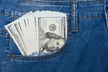 Dollars in jeans pocket. 100 dollar pocket money