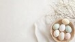 © t.sableaux - Natural Easter decorations feature bunnies and pastel eggs set on a beautiful linen tablecloth for a festive display