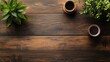© Alpa - Natural rustic wooden table top view with a cup of coffee and houseplants on top. Copy space