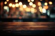 © ANZ studio - Dark wooden table with blurred bar lights background.