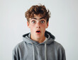 © Milla - Amazed young shocked guy isolated on white background portrait