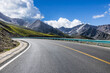 © ABCDstock - Asphalt highway road and mountain nature landscape in Xinjiang, China. Outdoor road background.