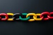 © Дмитрий Прудник - Multi-Colored Chain Links on a Dark Background: Symbol of Unity, Strength, and Diversity in Modern Stock Photography black history month