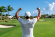 © Thanyarat - A golfer celebrating a successful shot, raising their arms in triumph as the ball lands near the hole