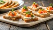 © parichart - Delicious Appetizers Smoked Fish on Toasted Bread with Creamy Spread and Fresh Herbs
