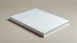 © AntariCode - White book with a blank cover set against a minimalistic neutral background highlighting simplicity