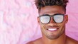© Mikus - A man wearing a pair of glasses smiles at the camera