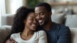 © Iurii - Couple enjoying a cozy moment together in a modern living room setting