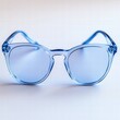© pimpat - Stylish Blue Tinted Sunglasses on a Light Background