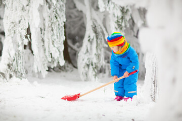 Wall Mural - Kids play in snow in winter park