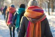 © Archibalttttt - People walking in snowy park wearing colorful scarves during winter