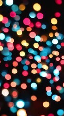 Leinwandbilder - A stunning display of multicolored bokeh lights creating a vibrant, dreamy effect on a dark backdrop, vertical video