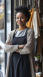 © Andrii Gatchenko - woman entrepreneur standing in her boutique welcoming customers with confidence