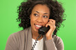 © Mark Adams - Close up of happy black business woman talking on phone and looking off-screen