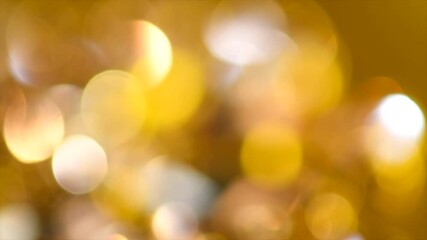 Wall Mural - holiday gold bokeh background. glitter golden blurred sparkles background. gold glitter blur dust ab