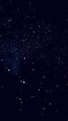 Poster - Abstract white random dotted pattern resembling snow on dark blue background, vertical video
