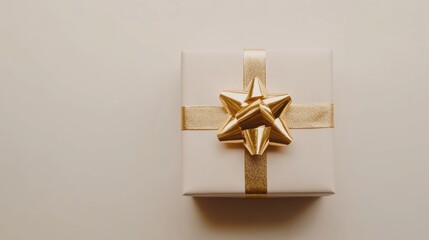 Wall Mural - Elegant white gift box with a shiny golden ribbon and bow, perfect for celebrations, birthdays, and holiday festivities, symbolizing joy and generosity in giving presents.