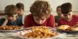 © koldunova - Children are Joyfully Enjoying a Festive Feast of Delightful and Delicious Foods Together