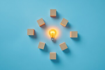 Wall Mural - a minimalist design featuring a glowing light bulb surrounded by wooden cubes, with each cube symbol