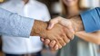 © Srinard - Overjoyed Couple Shakes Hands with Real Estate Agent After Finalizing the Purchase of Their New Home Expressing Excitement and Satisfaction Over Achieving This Milestone