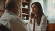 © TrendyImages - Doctor listens attentively to senior patient during consultation
