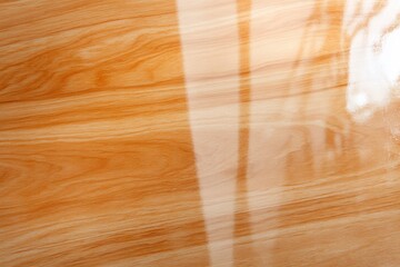 Wall Mural - A polished wooden surface featuring a warm, natural grain pattern.