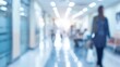 © Cyan Creative - A blurred image of a busy hallway in a public building, suggesting activity and movement.