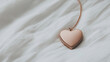 © Show - heart shaped locket resting on soft fabric, symbolizing love and memories. This elegant piece of jewelry captures essence of cherished moments and personal connections