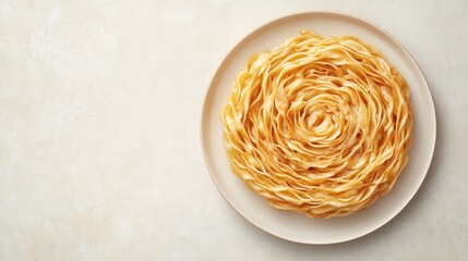 Wall Mural - Freshly Made Pasta Spirals on a Light Background in a Clean Plate