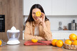 © Pixel-Shot - Young woman making tasty orange juice in kitchen