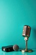 © Kanya - Aquamarine wall with retro style microphone and audio equipment, decoration, music