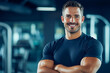 © Atmospheric stock - Confident young caucasian male fitness enthusiast smiling in gym