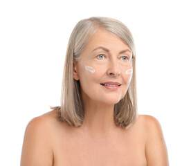 Wall Mural - Senior woman with face cream on white background