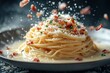 © Atiq Fuad - A plate of spaghetti with bacon and cheese