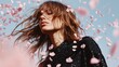 © indyntk - Minimal fashion photography with model in textured black attire, soft pastel confetti cascading, creating an airy yet bold atmosphere