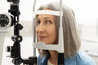 © Maria Vitkovska - Senior woman undergoing eye exam with slit lamp: healthcare and vision care