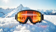 © ChrisKuz - Ski goggles on snowy mountaintop with reflection