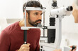 © Maria Vitkovska - Optometrist examining patient's eyesight with slit lamp biomicroscope in ophthalmology clinic
