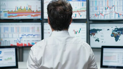 Wall Mural - Financial analyst monitoring global market trends on multiple screens in realtime