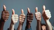 © Trisna - Close-up view of a group of people's hands showing a thumbs up gesture on a gray background, for your text message or advertising information.
