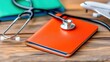 © weerasak - A stethoscope rests on an orange medical notebook, symbolizing healthcare, travel, and patient care, with a blurred airplane in the background.