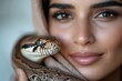 © Milos - An extraordinary close-up view of a woman's face with a snake wrapped around her, illustrated by her captivating smile and connection to the wild beauty surrounding her.