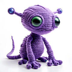 Wall Mural - A knitted soft toy in the form of a funny fairy-tale alien, made of woolen threads in purple tones. White background.