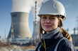 © Tetiana - NPP worker woman against of a nuclear reactor turbine in industrial setting generative AI