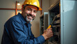 © Leah - Smiling Electrician Works on Electrical Panel