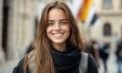 © Tondone - A young woman with a bright smile, standing in an urban environment. Her long hair and casual attire reflect a sense of joy and confidence, making her the focal point of the scene.
