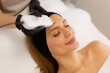 © BGStock72 - Revitalizing facial cleansing and ultrasonic massage for glowing skin during a tranquil spa session
