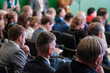 © Anton Gvozdikov - Group of professionals attentively listening during business seminar, focused on gaining insights and knowledge for career growth.