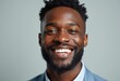 © Vibudhaart - A young African American man with a beard smiles brightly at the camera.